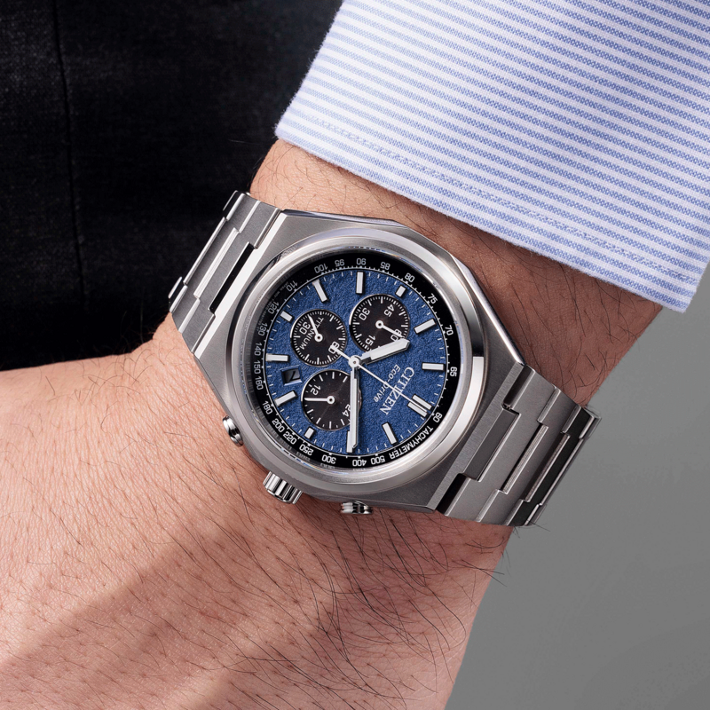 Citizen watch on wrist, blue face, titanium, Eco-Drive, chronograph, stylish accessory