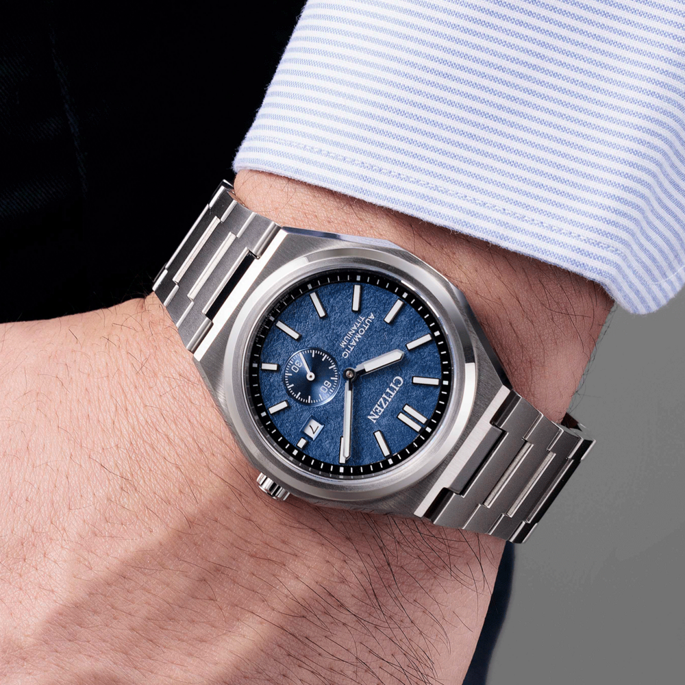 Citizen watch on wrist, blue dial, titanium, automatic, close-up shot